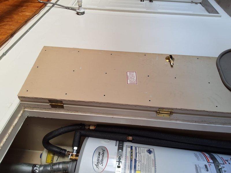 Completed warranty repair service on American water heater model GN40T1-3-6, serial number F24-017203. Accessed roof-mounted unit through exterior hatch and performed no hot water diagnosis and repair. Verified proper operation of water heater system, inspected connections and control components, and restored unit to full working condition under warranty coverage.