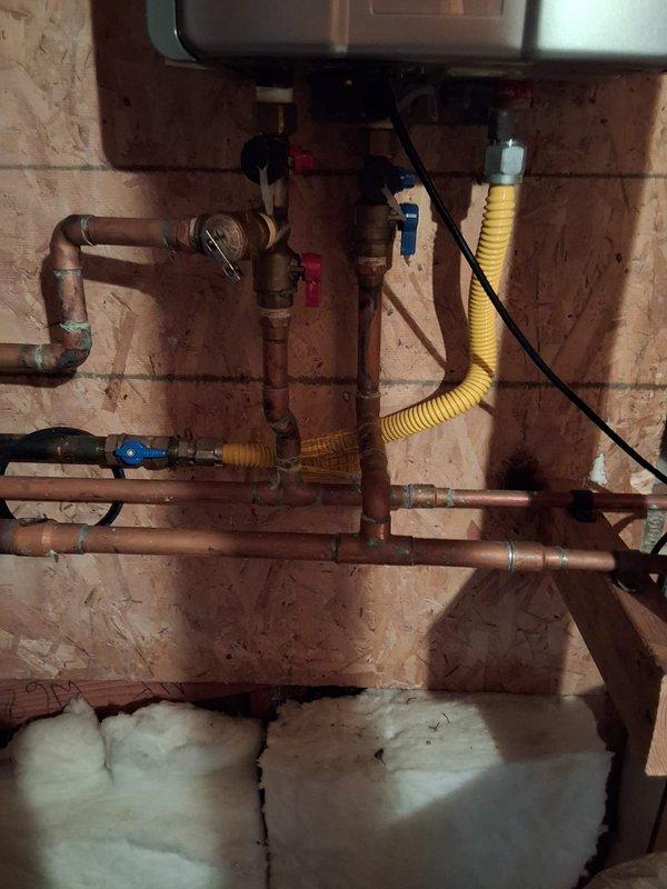 Performed warranty repair service on water heater unit Model RL94IN, Serial NK.CA-130283. Inspected plumbing connections, gas line, and electrical components at installation site. Verified proper operation and tested water temperature output at fixture to ensure system functioning within manufacturer specifications.