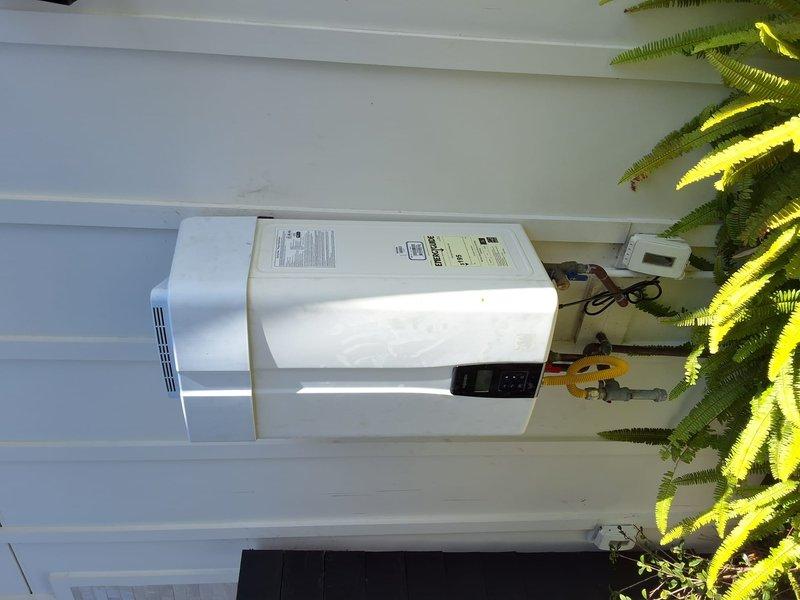 Completed warranty return visit to install replacement part for Navien NPE-210A tankless water heater (serial: 2082Y2230776619) that was experiencing no hot water condition with error code. Part had been previously ordered and unit was displaying fault code requiring component replacement. Successfully installed the ordered part, cleared error code from system, tested unit operation to verify proper heating function, and confirmed all connections secure. Unit now operating within normal parameters with no error codes present.