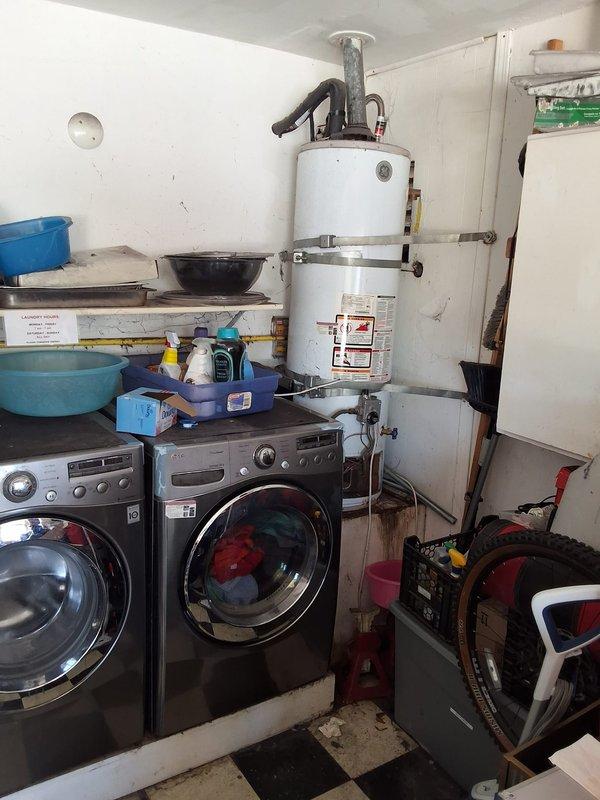 Responded to service call for leaking 40-gallon gas water heater in laundry room. Performed thorough inspection of unit and surrounding plumbing connections, documented existing conditions with photographs. Provided estimate for complete water heater replacement with new 40-gallon gas unit, discussed permit requirements and available payment options with customer.