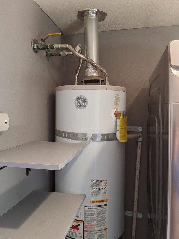 Performed inspection on existing 40-gallon gas water heater located in utility closet with reported gas leak. Assessed unit condition and confirmed need for replacement due to age and safety concerns. Discussed permit requirements with homeowner and provided estimate for new 40-gallon gas water heater installation, including proper venting and gas line connections per code requirements.