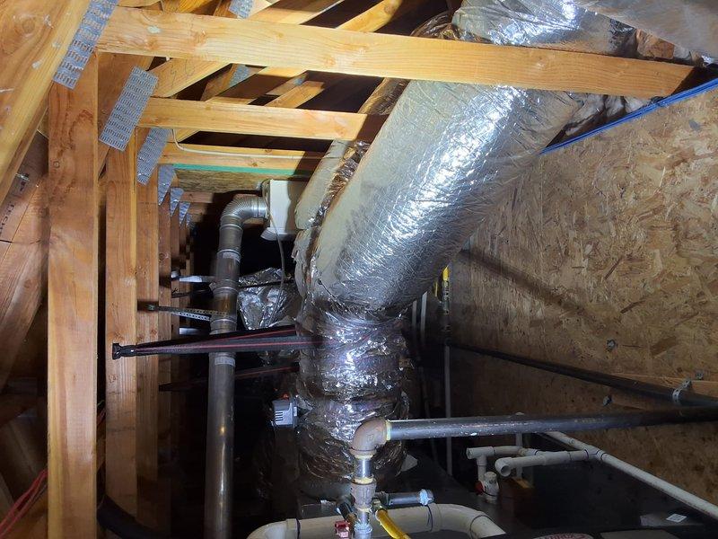 Responded to no hot water complaint at residential property. Accessed attic space to diagnose 2011 Noritz tankless water heater. Performed diagnostic evaluation of unit, inspected venting system, gas supply lines, and electrical connections. Examined flex duct routing and PVC condensate drainage system in attic installation. Identified issue preventing hot water production and completed necessary repairs to restore system operation.