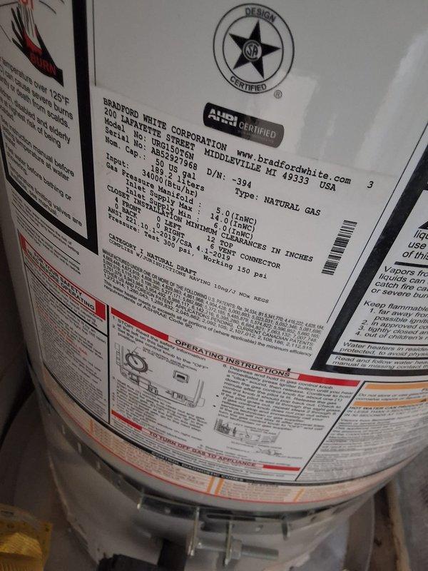 Responded to warranty repair call for Bradford White natural gas water heater model URG150T6N with damaged burner assembly. Upon inspection, confirmed burner had developed a hole requiring replacement. Replaced defective burner assembly with new manufacturer-warranted part, reconnected gas line, tested for proper ignition and flame pattern, and verified unit returned to normal operation with no gas leaks detected.