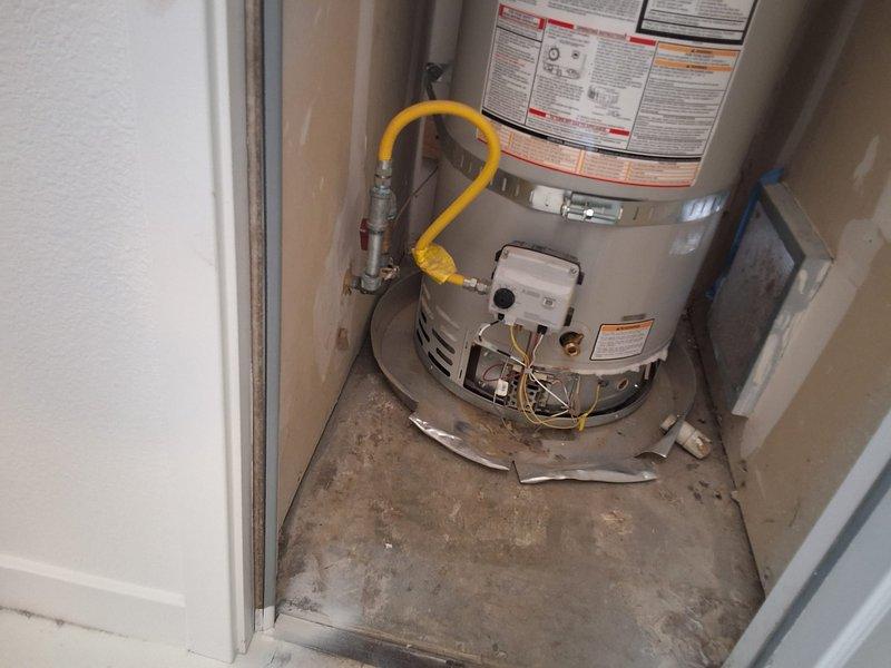 Responded to warranty repair call for Bradford White natural gas water heater model URG150T6N with damaged burner assembly. Upon inspection, confirmed burner had developed a hole requiring replacement. Replaced defective burner assembly with new manufacturer-warranted part, reconnected gas line, tested for proper ignition and flame pattern, and verified unit returned to normal operation with no gas leaks detected.