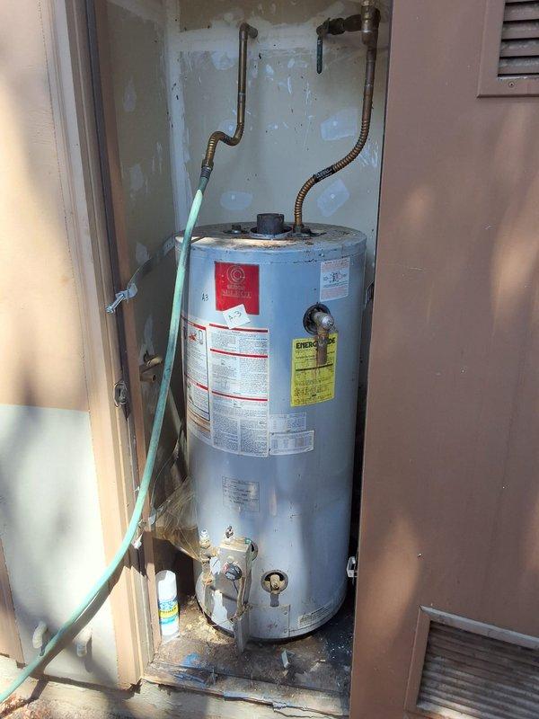 Responded to service call for 40-gallon gas direct vent water heater model PR540XODS (serial D06A095839) located in exterior closet with limited 27-inch depth clearance. Inspected existing unit and evaluated installation constraints due to shallow closet configuration. Discussed potential tankless water heater conversion as alternative solution to accommodate space limitations. Provided assessment and recommendations for replacement options. Permit requirements reviewed with property owner. Documented existing installation conditions and measurements for preparation of detailed estimate.
