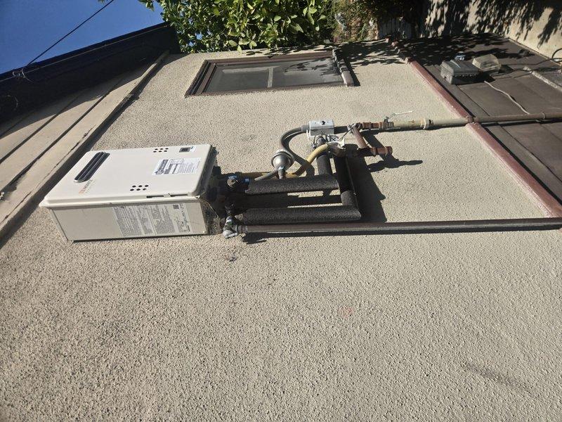 Performed routine maintenance flush on a natural gas tankless water heater unit model NNR662ODNG originally installed in February 2023. The unit is mounted on an exterior rooftop location with copper piping configuration including pressure relief valve connections. Completed descaling flush procedure to remove mineral buildup and ensure optimal heat exchanger performance and efficiency. Inspected all gas line connections, water supply lines, and venting components for proper operation. Unit tested successfully following maintenance and returned to normal operation with no issues identified.