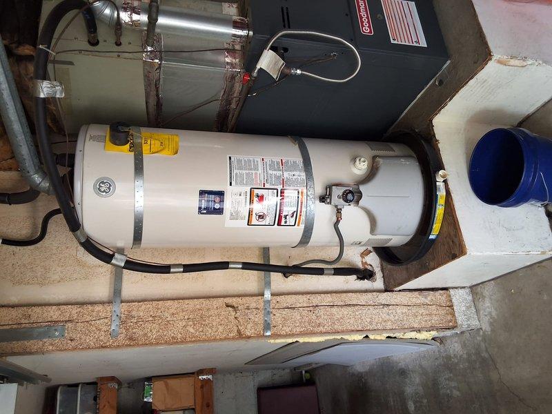 Replaced 20-year-old residential gas water heater with new 50-gallon gas unit (Model PG48T). Removed existing tank, installed replacement water heater with proper connections including water supply lines, gas line, and venting system. Performed pressure testing to verify system integrity and ensured all connections met code requirements. Advised homeowner of permit requirements for installation compliance.