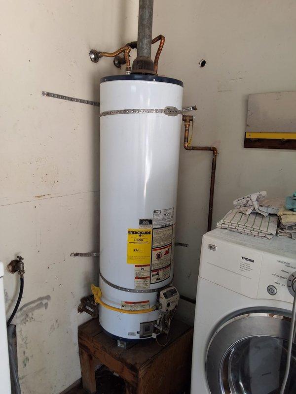 Performed inspection on Whirlpool water heater model NU40461-403 with pilot light failure. Unit determined to be subject to recall and replacement recommended due to age and safety concerns. Provided estimate for new GN40T1-3-6 water heater installation including necessary code modifications and permit requirements, with installation appointment scheduled.