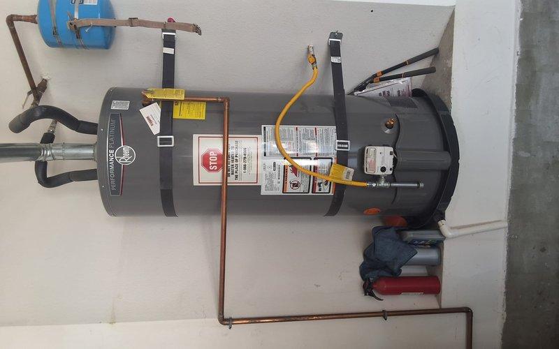 Responded to property management service call for water heater with no hot water and blinking red control light. Upon arrival, performed diagnostic evaluation on Rheem Performance Platinum model XG50T12HN38U1 (manufactured June 2018). Inspected unit installation, connections, gas supply line, copper piping, expansion tank, and all safety components. Documented equipment condition and findings with photographs. Contacted office from site with diagnostic results per property management protocol for pricing approval before proceeding with any repairs.