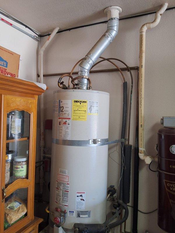 Responded to service call for leaking residential gas water heater with active bottom tank leak. Removed and disposed of failed approximately 50-gallon gas-fired water heater with undetermined model and serial number. Installed new 50-gallon gas water heater with proper venting, gas line connections, and water supply piping. Configured unit with code-compliant temperature and pressure relief valve discharge piping, secured all gas connections, and verified proper combustion air supply. Discussed permit requirements and obtained necessary permits for installation. Presented alternative tankless water heater options for future consideration. Tested all connections for leaks, verified proper gas pressure and burner operation, and confirmed adequate hot water delivery throughout residence upon completion.