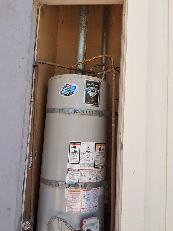 Responded to no hot water condition at residential property. Removed and replaced failed 50-gallon gas water heater with new American Standard 50-gallon gas unit in utility closet. Installation included connecting gas supply line, hot and cold water lines with shut-off valves, temperature and pressure relief valve, and proper venting through existing exhaust system. Verified all connections for leaks, tested gas control valve operation, and confirmed proper combustion and venting. Unit installed per manufacturer specifications and local code requirements. Permit obtained prior to installation. System tested and operational upon completion.