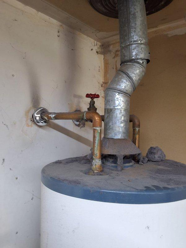 Responded to a leaking 40-gallon gas water heater located in the garage. Removed and disposed of the failed Rheem unit and installed a new 40-gallon gas water heater with proper venting and connections. Secured the new tank with seismic strapping, connected gas supply line and water lines with shut-off valves, installed temperature and pressure relief valve with discharge pipe, and verified all connections for proper operation and code compliance.