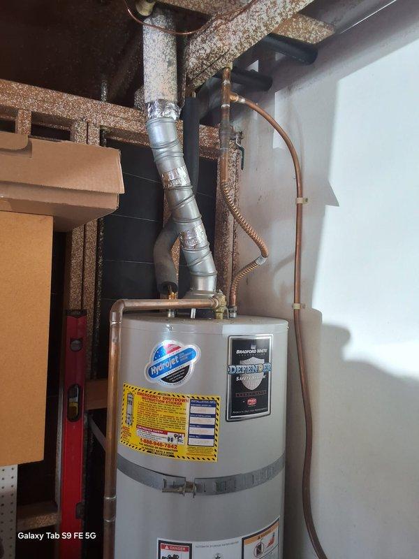 Replaced a 14-year-old 50-gallon Rheem gas water heater (Model MI5036FBN, Serial J1316303784) that had reached end of serviceable life. Installed new 50-gallon Guardian gas water heater with proper venting and plumbing connections. Connected copper supply lines, installed flexible gas connector, and secured metallic vent pipe to existing exhaust system. Tested all connections for leaks, verified proper combustion and venting operation, and confirmed hot water delivery to fixtures.