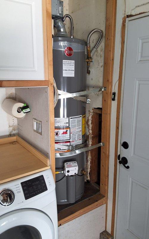 Responded to service call for leaking 40-gallon gas water heater. Performed inspection of existing Rheem unit installed in utility closet with exposed framing. Assessed leak condition and determined unit requires replacement. Provided estimate for new gas water heater installation using model GN40T1-3-6, discussed permit requirements and necessary code compliance modifications, and documented existing installation configuration with photographs. Scheduled follow-up appointment for replacement work.