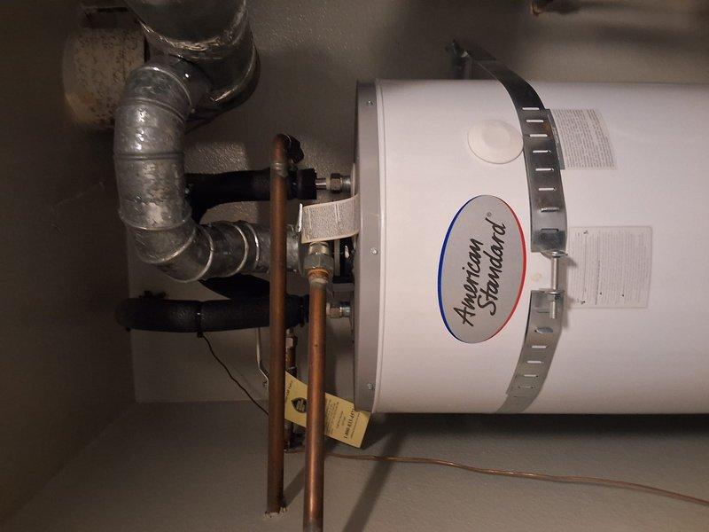 Performed warranty inspection on American Standard water heater model GN50T1-3-6, serial F23-025331, previously installed in October 2024. Verified system pressure readings on PROFLO gauge, inspected all plumbing connections including copper piping and circulator pump assembly, and confirmed proper operation of unit with no issues found requiring repair at this time.