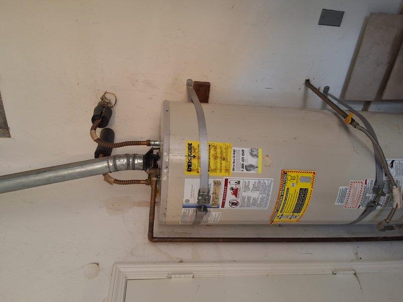 Replaced leaking GE 50-gallon gas water heater (Model SG50T12XA) with new American Standard 50-gallon gas unit. Completed installation with proper venting connections, copper supply lines with flexible connectors, pressure relief valve, and all code-required safety components. Obtained and completed work under city permit requirements.