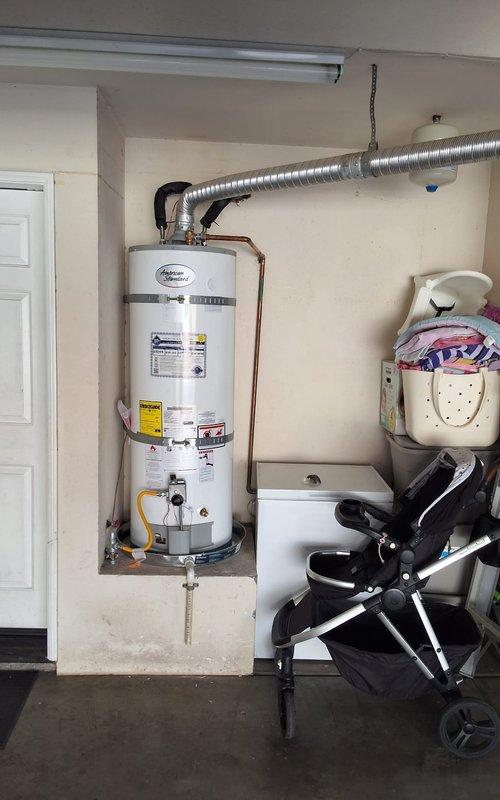 Responded to no pilot light condition on American Standard water heater model GN50T1-3-6. Measured and trimmed baffle to proper specifications, then reinstalled flame arrestor screen securely into position. Verified pilot ignition system operation and confirmed unit returned to normal heating operation under warranty coverage.