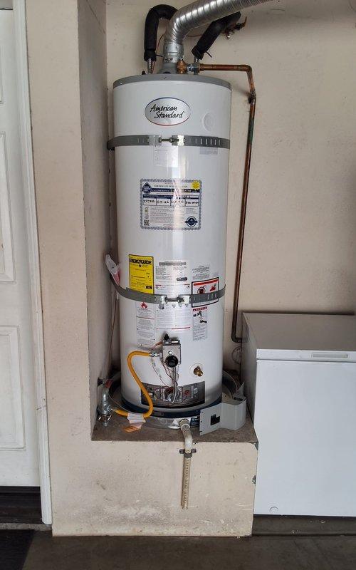 Responded to no pilot light condition on American Standard water heater model GN50T1-3-6. Measured and trimmed baffle to proper specifications, then reinstalled flame arrestor screen securely into position. Verified pilot ignition system operation and confirmed unit returned to normal heating operation under warranty coverage.