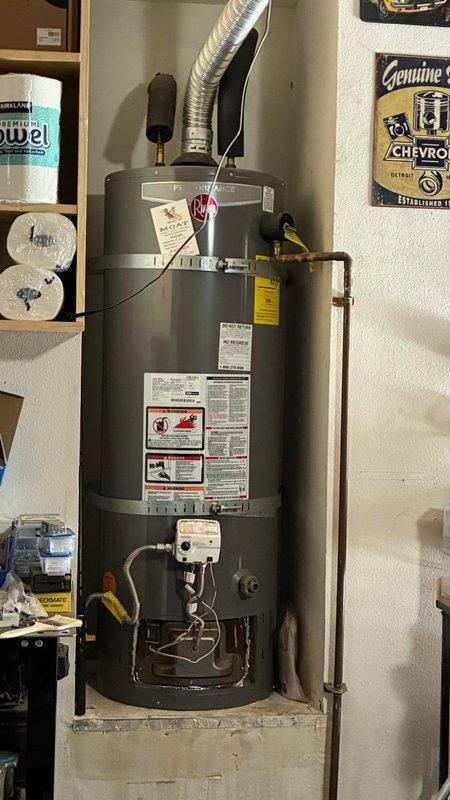 Responded to no hot water condition at residential property. Removed and replaced failed 2016 Rheem XG48T06EN40U1 atmospheric vent water heater with new Rheem GN50T1-3-6 50-gallon natural gas unit. Installed unit on concrete platform in garage utility area with proper venting through flexible metallic duct. Connected copper supply and discharge lines with code-compliant installation including TPR valve, expansion tank provisions, and gas line connections. Applied insulation to hot water piping connections. Verified proper combustion venting, tested all connections for leaks, and confirmed unit operation. Obtained permit for installation to meet local code requirements. Unit tested and operational upon completion.