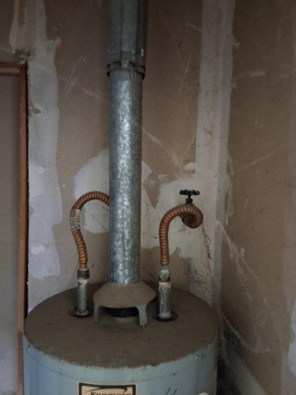 Replaced 30-year-old 30-gallon gas water heater with new 40-gallon gas unit per property management specifications. Disconnected and removed existing water heater, installed upgraded capacity replacement with all necessary connections including gas line, water supply lines, temperature and pressure relief valve, and proper venting. Verified all connections for leaks, tested unit operation, and ensured compliance with code requirements.