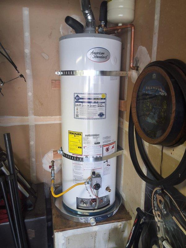Responded to warranty call for American Standard water heater (Model GN50YT1-3-6) installed three months prior where pilot light would not relight after customer returned from vacation. Inspected gas control valve, thermocouple, and pilot assembly; successfully relit pilot and verified proper ignition sequence and burner operation. Unit tested and confirmed operational with all safety controls functioning correctly.