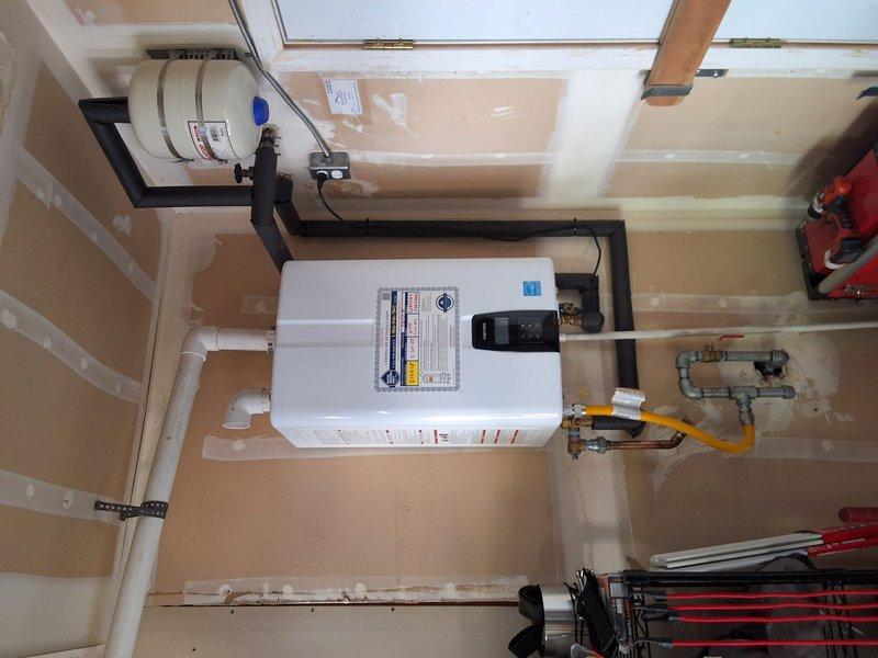 Performed annual maintenance flush on Navien NPEA2 tankless water heater unit. Completed descaling procedure to remove mineral buildup from heat exchanger, flushed system with cleaning solution, and verified proper operation of all components including gas valve, ignition system, and water flow sensors. Unit tested and confirmed operating within manufacturer specifications upon completion.