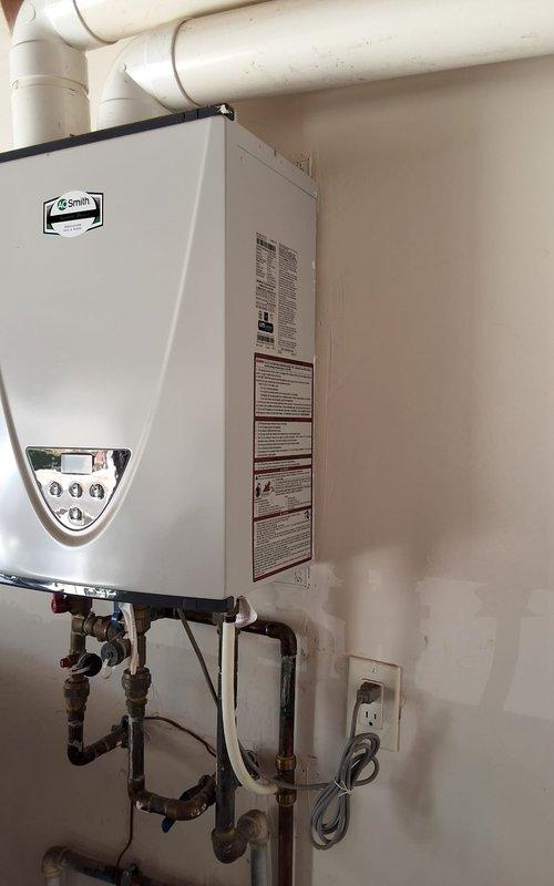 Performed general maintenance and flush service on a 6-year-old Takagi tankless water heater, model TH3JDVN. Completed routine descaling procedure to remove mineral buildup, flushed system with appropriate cleaning solution, inspected all connections and components for proper operation, and verified unit functionality upon completion.