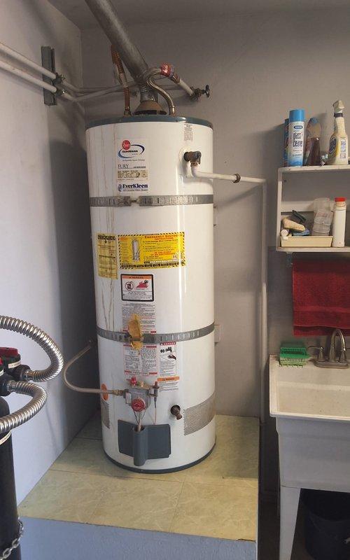 Performed preventative maintenance inspection on a 2006 Rheem 50-gallon gas water heater (Model: 42V50 36EF, Serial: 0405508370). Evaluated overall unit condition, plumbing connections, pressure relief valve operation, and venting system integrity. Documented existing installation with seismic strapping and copper piping configuration. Provided estimate for water heater replacement and discussed permit requirements for future installation work.