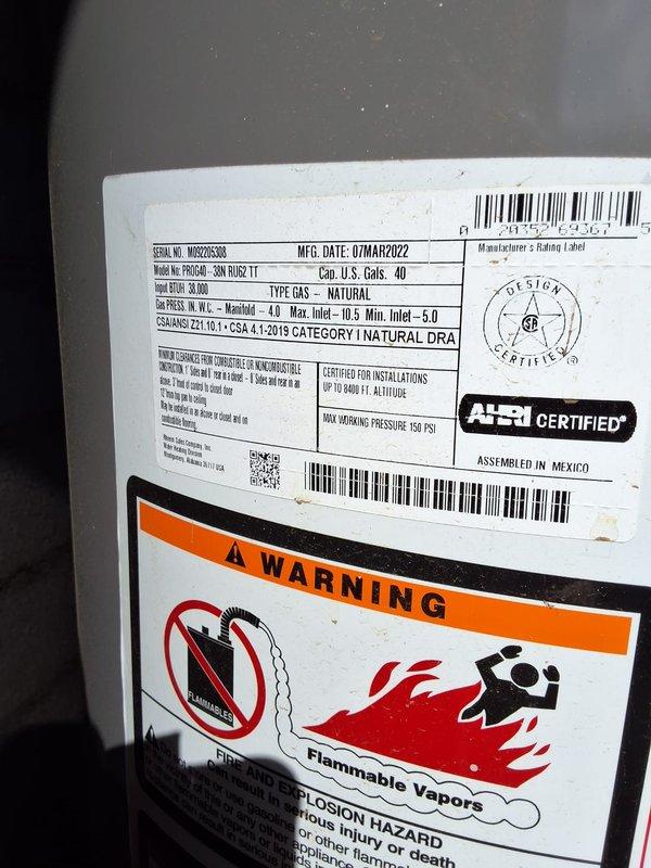 Responded to return customer request to assess water heater replacement needs for triplex property. Inspected existing Ruud Professional 40-gallon natural gas water heater, manufactured March 2022, model 40 NORT 11, serial number M0820283838. Unit marked as 4 years old and located in basement utility area with standard venting and plumbing connections. Confirmed property has single water heater serving the triplex rather than three separate units. Documented equipment specifications, installation configuration, and current condition through photographic inspection. Provided replacement options and recommendations for gas water heater upgrade.