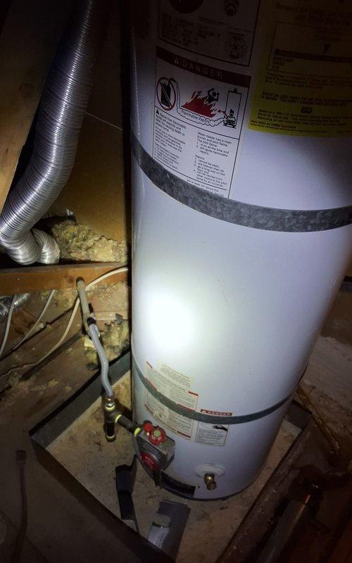 Responded to no hot water complaint and performed inspection of 40-gallon gas water heater located in basement utility area. Homeowner was not present to provide additional unit information including exact age, model, or serial number details. Assessed installation including venting system, gas connections, water supply lines, and shut-off valves. Documented existing water heater condition and installation setup with photographs. Discussed replacement options and permit requirements for new water heater installation. Provided estimated scope of work for complete water heater replacement including removal of existing unit, installation of new equipment, and required plumbing modifications. Reviewed available payment options with customer. Scheduled installation arrival window and confirmed customer understanding of project timeline and requirements.