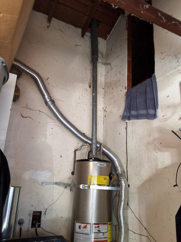 Responded to service call for 50-gallon gas water heater with no pilot light. Upon inspection, determined the 2016 unit had failed and required full replacement. Removed existing 50-gallon gas water heater and installed new 50-gallon gas unit with proper venting connections and gas line hookups. Verified all plumbing connections, tested gas valve operation, lit pilot light, and confirmed proper heating function. Discussed permit requirements with property owner and documented installation with photographs showing completed work and proper clearances.
