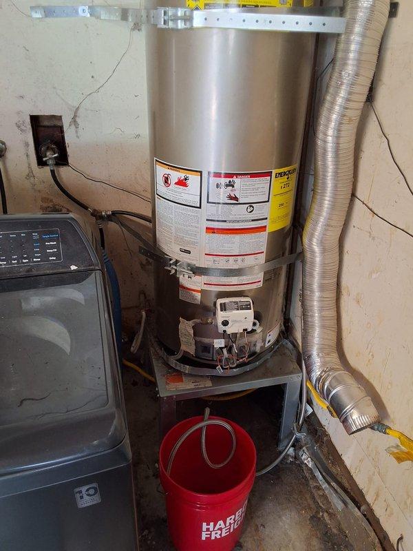 Responded to service call for 50-gallon gas water heater with no pilot light. Upon inspection, determined the 2016 unit had failed and required full replacement. Removed existing 50-gallon gas water heater and installed new 50-gallon gas unit with proper venting connections and gas line hookups. Verified all plumbing connections, tested gas valve operation, lit pilot light, and confirmed proper heating function. Discussed permit requirements with property owner and documented installation with photographs showing completed work and proper clearances.