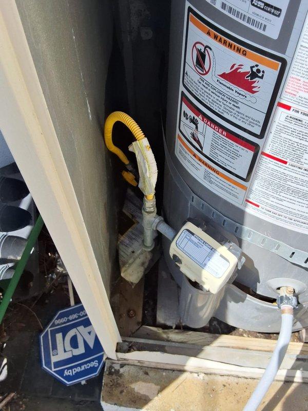 Responded to service call for gas leak at top of existing 40-50 gallon water heater. Performed inspection of Rheem Performance Platinum unit and confirmed active gas leak at upper connections. Provided customer with estimate options for both repair and complete unit replacement, discussed permit requirements for replacement installation, and documented equipment condition with photographs.