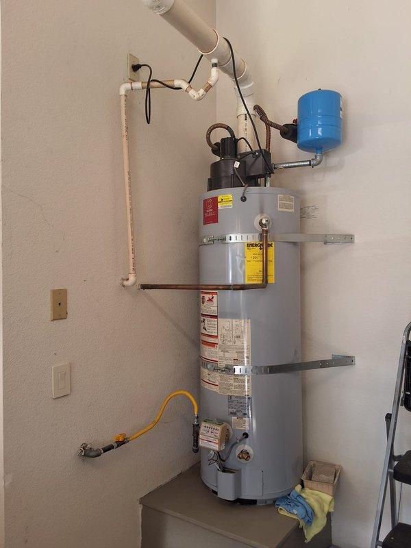 Completed return visit to assess 15+ year old 50-gallon power vent water heater (Model GASGS650YBVIT100) and verify optimal replacement specifications. Upon inspection, identified leaking water line requiring immediate attention in addition to aged unit replacement. Recommended and discussed installation of URG1PV506N power vent model as suitable replacement option. Reviewed permit requirements with property owner and provided detailed written estimate for complete water heater replacement including necessary repairs to compromised water line connections. Documented existing installation configuration including expansion tank, venting system, and gas line setup to ensure proper replacement specifications and code compliance.