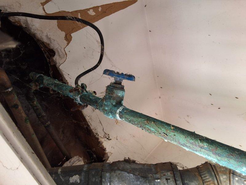 Responded to service call for water heater with pilot light failure on model SG40T12XA01. Upon inspection, determined unit was beyond economical repair due to age and condition. Removed and properly disposed of existing 40-gallon conventional tank water heater. Installed new American Standard residential water heater with complete plumbing connections including copper supply lines, expansion tank, temperature and pressure relief valve, and proper venting. Applied pipe insulation to hot and cold water lines for energy efficiency. Replaced corroded shut-off valve that showed significant oxidation and deterioration. Addressed water damage concerns in installation area. Secured necessary permit for Imperial Beach jurisdiction prior to installation. Tested all connections for leaks, verified proper operation of new unit, and confirmed adequate hot water delivery throughout the residence.