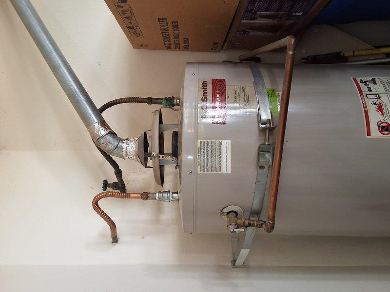 Performed inspection and estimate on existing Smith brand water heater (Model: FCG75270, Serial: AO5J042794) per customer request for replacement. Evaluated current installation including all plumbing connections, pressure relief valve, flexible water lines, and copper piping configuration. Discussed permit requirements, provided ballpark pricing estimate for replacement options, and reviewed available payment methods with customer.