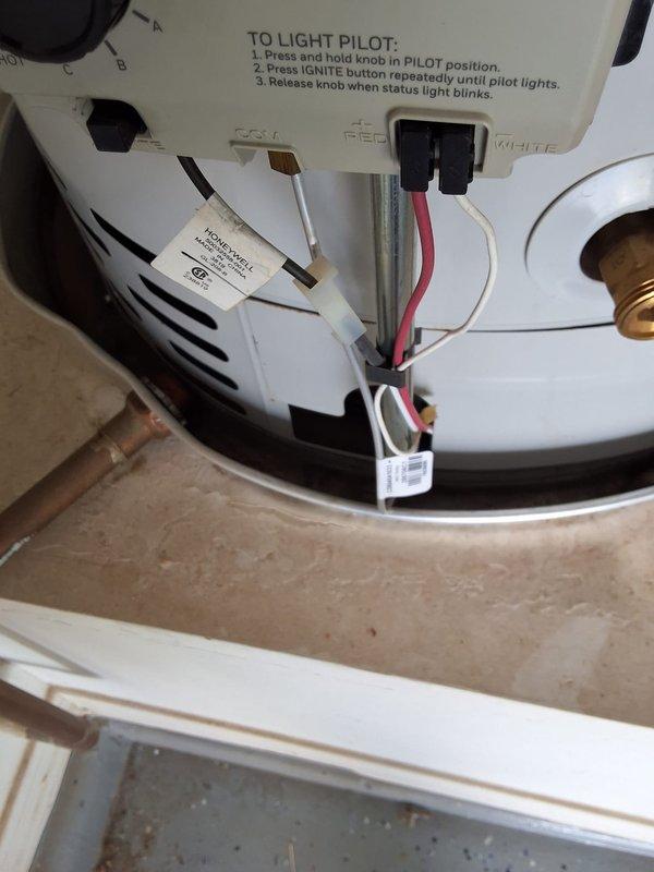 Responded to service call for water leak on residential water heater unit model RG250T6N, serial number WC4485503. Upon inspection, identified potential leak source as either the tank itself or the temperature and pressure relief valve. Documented unit condition with photographs showing gas control assembly, pilot light system, electrical connections, and venting configuration. Inspected all plumbing connections including copper supply lines and brass fittings for signs of moisture or corrosion. Presented customer with repair and replacement options, including T&P valve replacement with associated labor or full tank replacement. Customer to advise on preferred course of action for scheduling follow-up service.