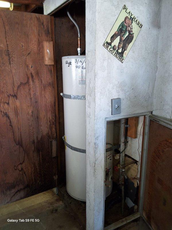 Replaced a 24-year-old leaking 40-gallon gas water heater (Model: 5G40T12XA01, Serial: GELN0102120804) in residential basement utility area. Removed existing failed unit, installed new 40-gallon gas water heater with proper seismic strapping, connected copper supply lines and gas piping, installed temperature and pressure relief valve with discharge pipe, verified all connections for leaks, and tested unit operation. Discussed permit requirements with customer's family representative and confirmed available payment methods.