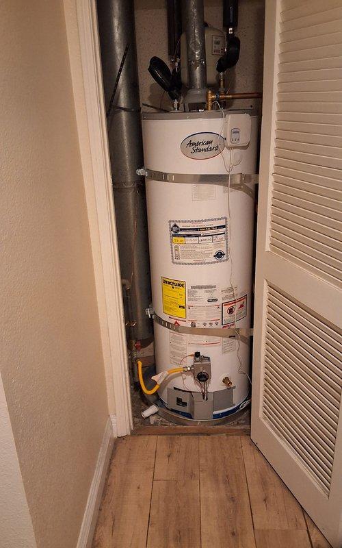 Completed warranty inspection on American Standard water heater model GN50T1-3-6, serial K25-052337, installed in residential utility closet. Unit found operating properly with all connections secure, gas valve functioning correctly, and venting system intact. No defects identified; installation meets manufacturer specifications and local code requirements.