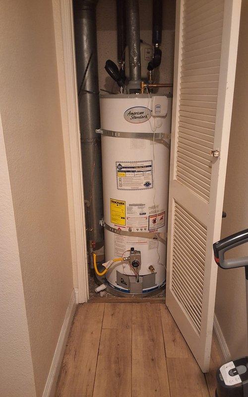 Completed warranty inspection on American Standard water heater model GN50T1-3-6, serial K25-052337, installed in residential utility closet. Unit found operating properly with all connections secure, gas valve functioning correctly, and venting system intact. No defects identified; installation meets manufacturer specifications and local code requirements.