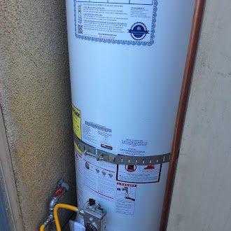 Replaced leaking 50-gallon gas water heater (Bradford White model UM0T6FRN, installed 2001) with new American Standard 50-gallon gas unit. Installation included connecting copper water supply lines, yellow flexible gas line, and proper venting configuration. City permit obtained for installation compliance.
