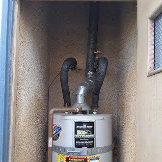 Replaced leaking 50-gallon gas water heater (Bradford White model UM0T6FRN, installed 2001) with new American Standard 50-gallon gas unit. Installation included connecting copper water supply lines, yellow flexible gas line, and proper venting configuration. City permit obtained for installation compliance.