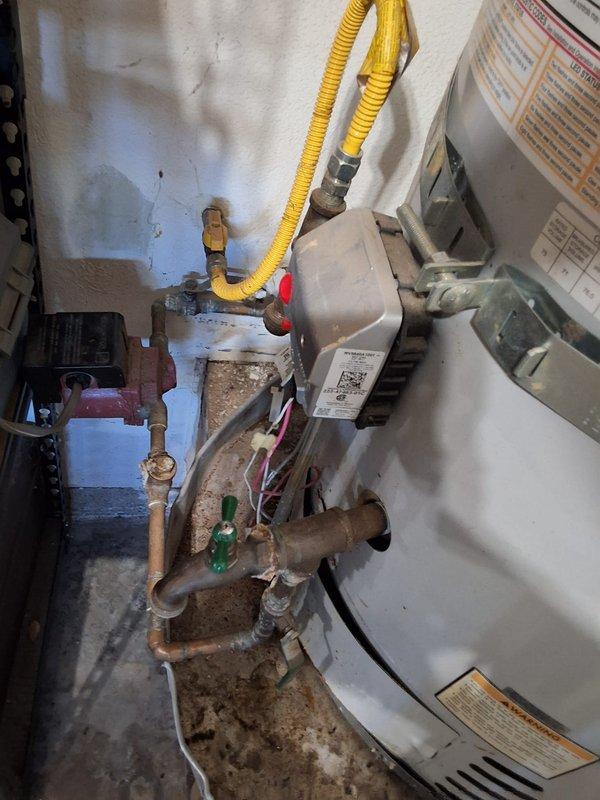 Responded to service call for leaking 75-gallon residential water heater requiring complete replacement. Removed and disposed of failed unit, then installed new 75-gallon water heater with proper venting and code-compliant connections. Connected gas supply line using flexible corrugated connector, installed new copper water supply lines with shutoff valves, and secured unit to structural supports per manufacturer specifications. Verified all connections for leaks, tested temperature and pressure relief valve operation, and confirmed proper combustion and venting. Advised property owner of permitting requirements for water heater replacement work.