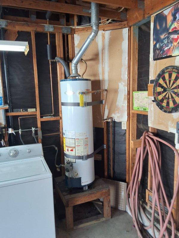 Responded to service call for leaking 30-gallon gas water heater (Model: MFG153030T3NOV, Serial: 0649108780) located in unfinished basement utility area. Conducted thorough inspection of existing Whirlpool unit, photographed installation including water and gas line connections, venting configuration, and surrounding workspace conditions. Assessed leak source and determined unit requires replacement due to age and condition. Provided estimate for installation of 40-gallon gas water heater replacement contingent on dimensional verification for available space. Discussed permit requirements with customer, who requested permit be obtained for installation work. Reviewed available payment options and provided ballpark estimate range for complete replacement including new unit, installation labor, venting modifications if needed, and permit fees.