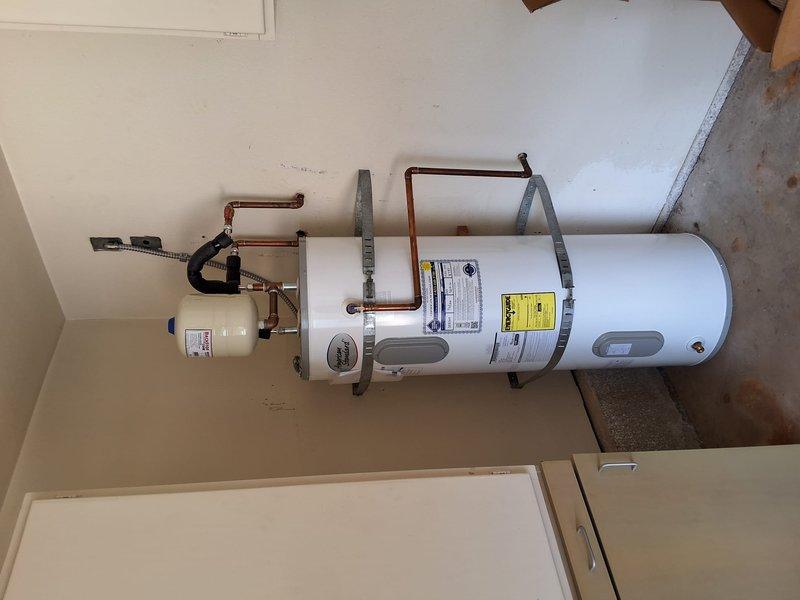 Responded to no hot water complaint on Enstrom ENS50H-6 water heater (S/N F25-033797) under first-year warranty. Inspected unit and verified all plumbing connections, expansion tank, and electrical components were functioning properly. Documented installation with photos and confirmed system operational per manufacturer specifications.