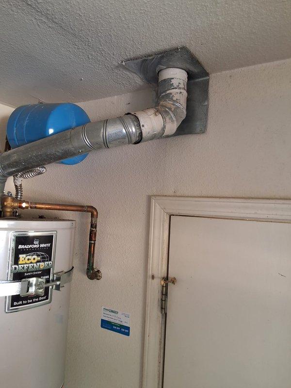 Responded to service call for leaking residential water heater. Removed and disposed of existing 50-gallon gas water heater. Installed new American Standard 50-gallon gas water heater with proper venting system, including metallic ductwork and ceiling penetration boot. Connected copper supply lines, gas line, and installed drain pan. Verified all connections for leaks, tested unit operation, and ensured proper exhaust ventilation. Obtained required city permit for installation. System tested and left in full working order.