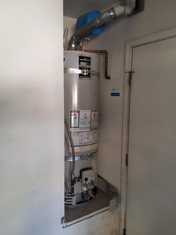 Responded to service call for leaking residential water heater. Removed and disposed of existing 50-gallon gas water heater. Installed new American Standard 50-gallon gas water heater with proper venting system, including metallic ductwork and ceiling penetration boot. Connected copper supply lines, gas line, and installed drain pan. Verified all connections for leaks, tested unit operation, and ensured proper exhaust ventilation. Obtained required city permit for installation. System tested and left in full working order.