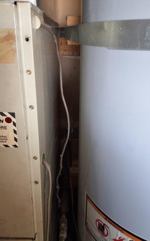 Responded to service call for 40-gallon gas-powered residential water heater requiring diagnostic and repair evaluation. Performed comprehensive inspection of unit including burner assembly, pilot light system, thermocouple, gas valve, and venting components. Assessed condensate drain line routing and verified proper installation clearances in confined utility space. Informed customer of upcoming regulatory mandates affecting gas appliance installations and provided options for repair versus replacement. Customer elected to proceed with repair attempt prior to considering full unit replacement. Completed necessary repairs to restore hot water functionality and verified all safety systems operating within manufacturer specifications.