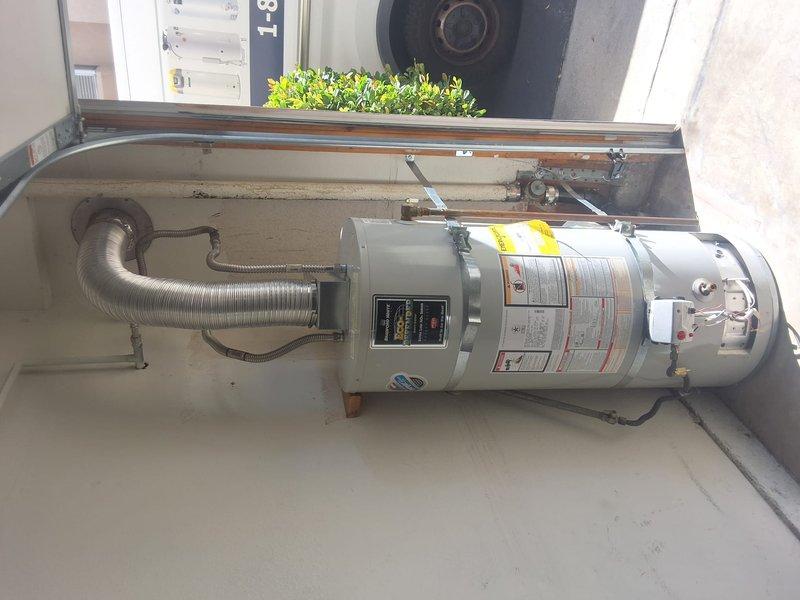 Responded to service call for pilot light issue on residential water heater. Upon arrival, inspected unit model UDS140S6FRN, serial number JC16392843. Diagnosed pilot light failure and provided customer with repair options including parts and labor estimate. Discussed complete water heater replacement as alternative solution and provided free estimate for new unit installation. Informed customer of permit requirements and associated fees for replacement work if needed. Documented equipment condition with photographs showing existing installation configuration and unit specifications. Customer to advise on preferred course of action for pilot light repair versus full replacement.
