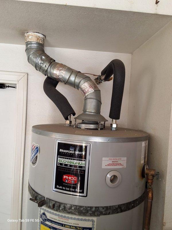 Responded to service call regarding 75-gallon Bradford White gas water heater (Model URG275H6N, Serial SG41793773) originally installed in 2018 under Fidelity warranty #FN6831960. Customer requested installation of third earthquake strap to bring unit into compliance with local seismic requirements for home sale. Upon arrival, inspected existing water heater installation and confirmed unit currently secured with two earthquake straps. Verified water heater model information and installation details. Documented current installation configuration with photographs showing Bradford White Ecomatic IV Series unit with standard gas connections, venting, and plumbing. Matter requires office review for warranty coverage determination and approval prior to completing additional earthquake strap installation.
